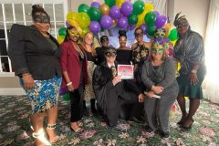 Member-Angela-Stokes-Scholarship-Recipient-with-her-family-and-co-workers